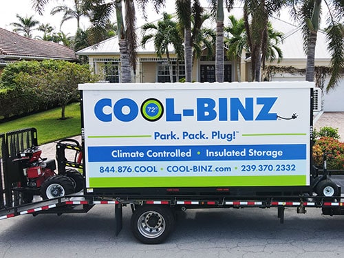 cropped image of cool binz insulated storage container awaiting un-hitching in front of house