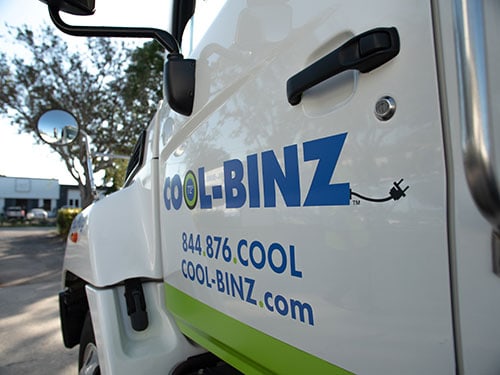 closeup shot of cool binz truck driver side door with logo and company info
