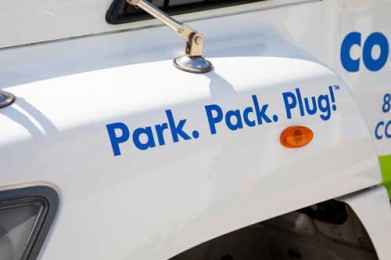 cool binz slogan of park, pack, plug on the side of cool binz truck hood