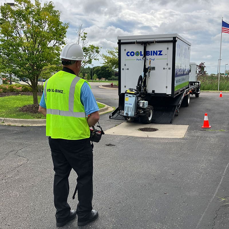 Technician unloading rented storage bin