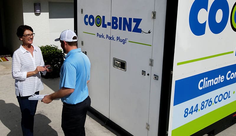 Customer standing with Cool-Binz Technician outside of rental bin