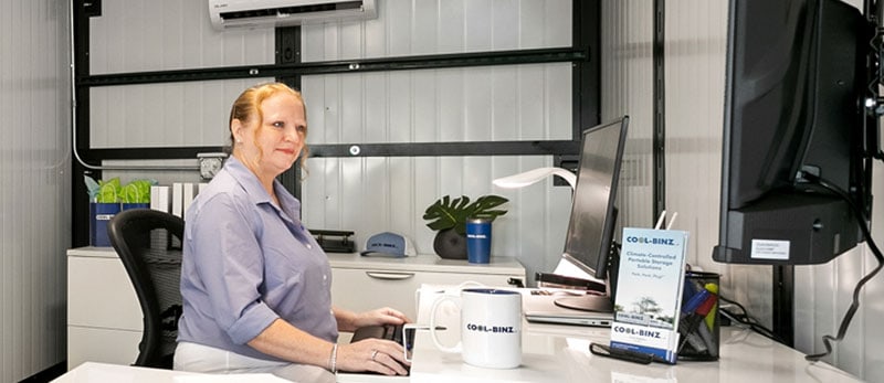 Woman at desk in Cool-Binz mobile office unit