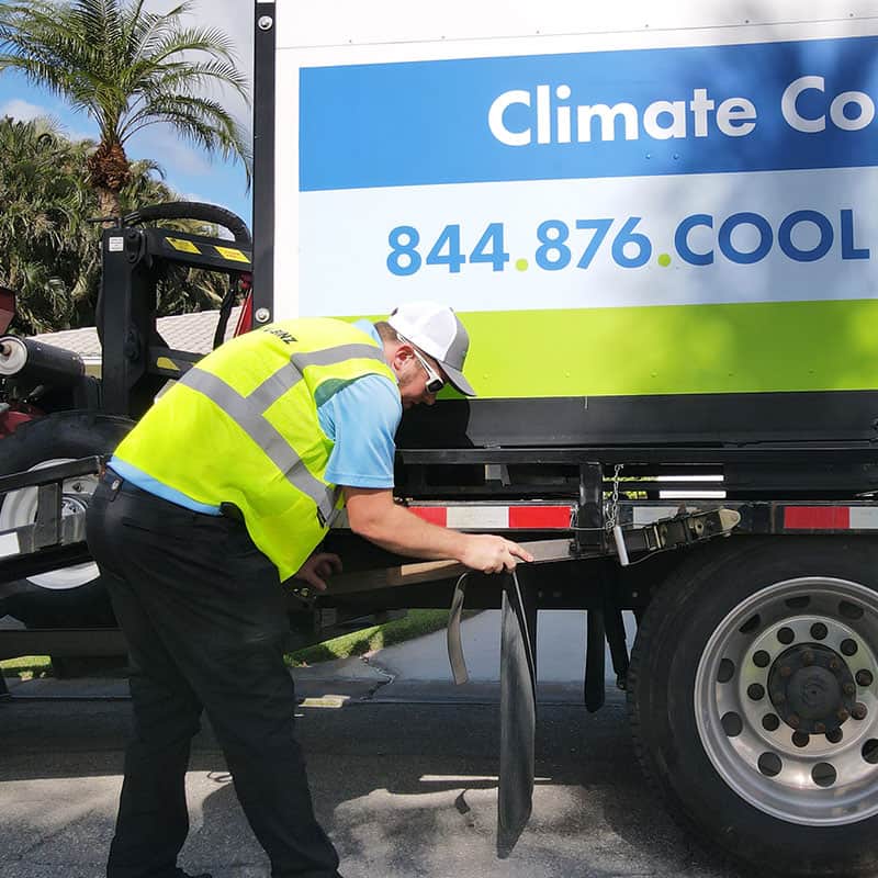 Technician unloading mobile storage bin