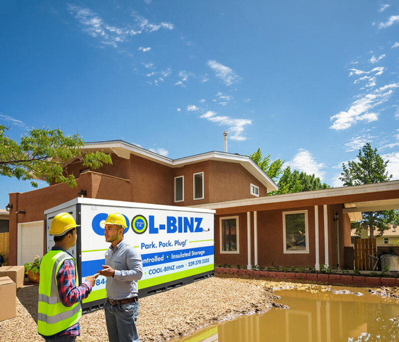 Workers conversing outside home